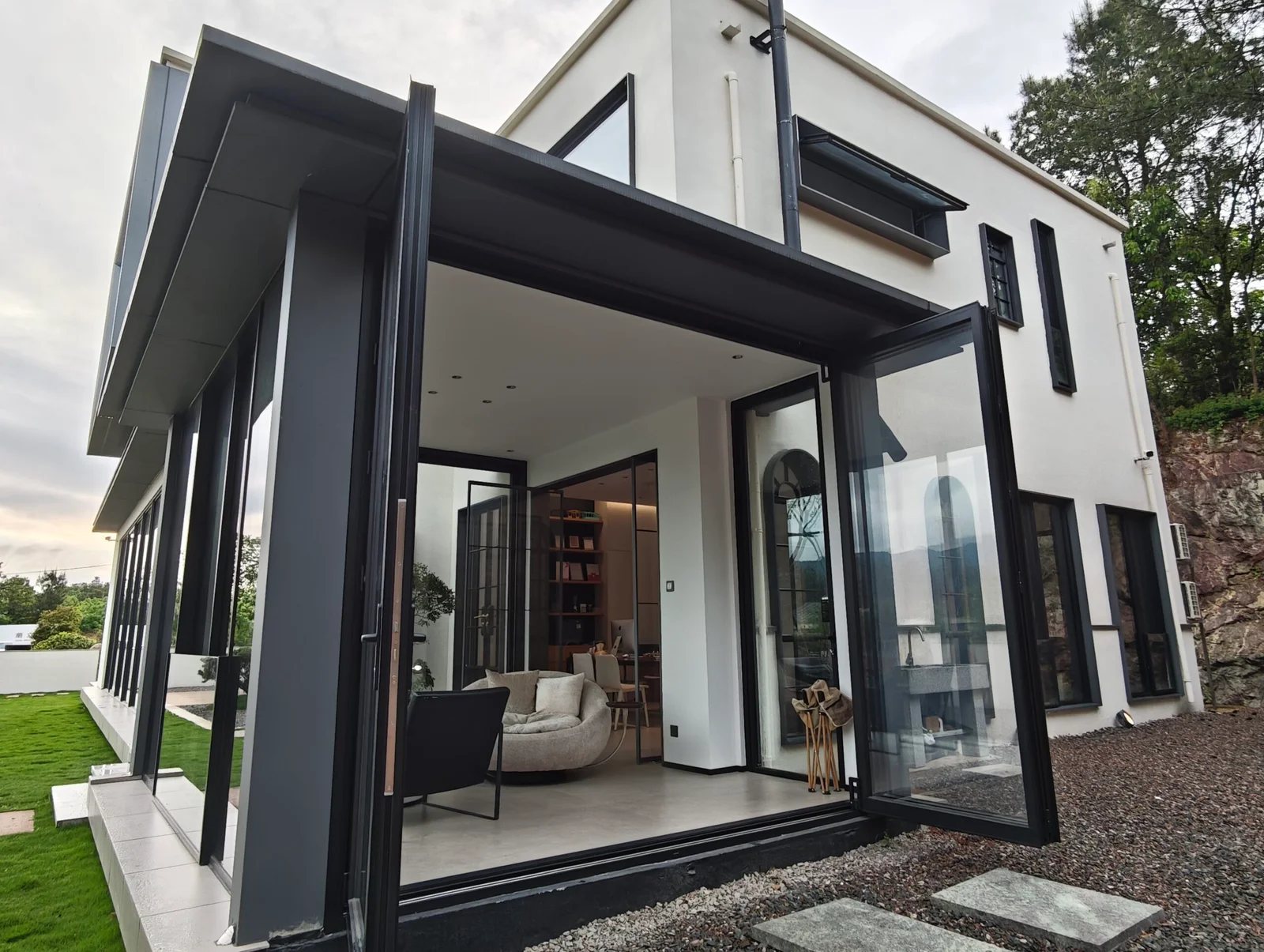 Modern Dearborn style home with black aluminium bi-fold doors and large windows